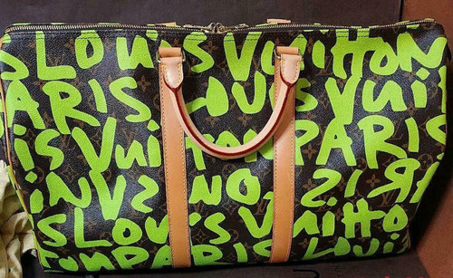 Louis Vuitton Keepall 50 Stephen Sprouse Graffiti in green Monogram canvas with Vachetta leather trim and gold-tone hardware