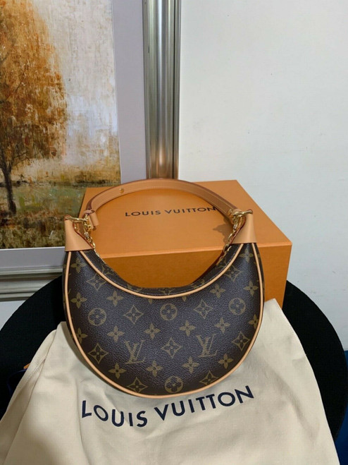 Louis Vuitton Loop Monogram Canvas half-moon baguette bag with gold-tone chain and adjustable leather strap
