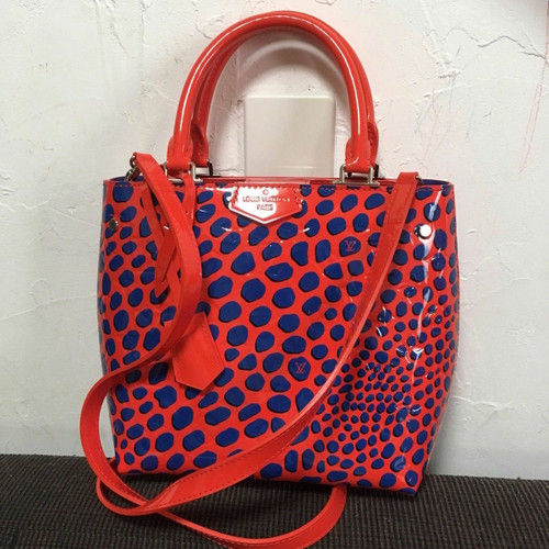 Louis Vuitton Alma BB in red Vernis patent leather with raised jungle dot accents and silver-tone hardware
