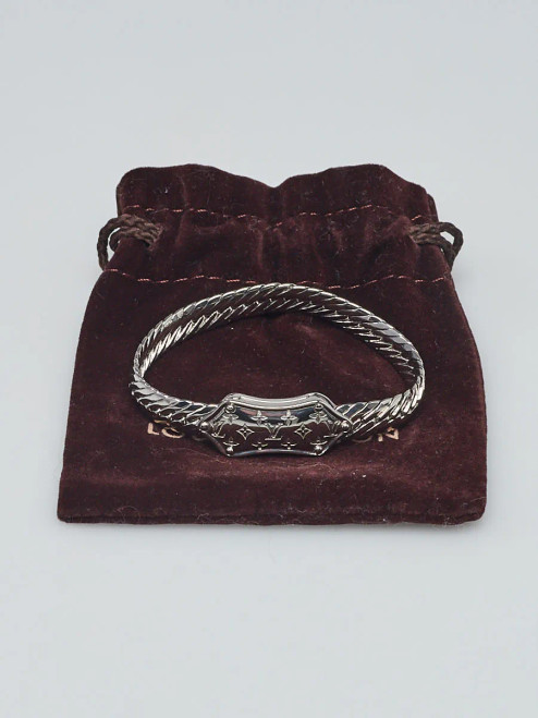 Louis Vuitton Silvertone Metal Nanogram Chain Bracelet. Explore this elegant accessory, discover its intricate design, and find out where to acquire this classic designer bracelet