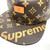 The image shows a stylish strapback cap featuring a collaboration between Louis Vuitton and Supreme. The cap is adorned with the classic Louis Vuitton monogram pattern in light brown and prominently displays the Supreme logo on the brim. This luxurious and fashionable cap is a must-have for streetwear enthusiasts and collectors.

This listing should help attract attention and provide all the key details potential buyers are looking for. Let me know if there's anything else you need!