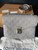 Louis Vuitton Pochette Metis Monogram Empreinte Leather in Turtledove Grey – 100% Authentic, New
