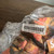 Use descriptive alt text: "Authentic Supreme SS24 Canvas Boonie Hat Orange Camo front view