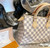 Louis Vuitton Speedy 25 Damier Azur canvas handbag with rolled leather handles and engraved padlock
