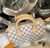 Louis Vuitton Speedy 25 Damier Azur canvas handbag with rolled leather handles and engraved padlock