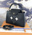 Authentic Louis Vuitton Capucines PM tote featuring layered leather and metal stud flower embellishments