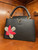 Louis Vuitton Capucines MM Black with Python Flower front view