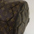 Close-up of Louis Vuitton Monogram Macassar Neo Sporty Hexagon Boston Bag handles