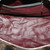 Close-up of Louis Vuitton Monogram Macassar Neo Sporty Hexagon Boston Bag handles