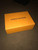 Close-up of Louis Vuitton Soft Trunk Bag orange chain detail