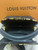 Side profile of Louis Vuitton Capucines Mini M56669 showing removable wide strap and leather top handle