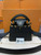 Front view of Louis Vuitton Capucines Mini M56669 in black Taurillon leather with gold Monogram Flower crown