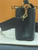 Rear view of Louis Vuitton Capucines Mini M56669 in black Taurillon leather highlighting smooth back panel