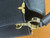 Side profile of Louis Vuitton Capucines Mini M56669 showing removable wide strap and leather top handle