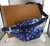 Louis Vuitton Discovery Bumbag PM M20587 in blue Monogram Bandana calf leather with front and back zip pockets