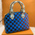 "Louis Vuitton Épi Damier Race Alma BB in blue and green checkered leather with silver-tone hardware and removable straps