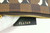 Louis Vuitton Damier Ebene LV Logo Pochette 91LK412S in brown canvas with pink Louis Vuitton logo