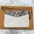 Louis Vuitton Double Zip Pochette N96322 in white Monogram Empreinte leather with silver zippers and chain strap
