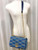 Louis Vuitton Twist MM shoulder bag in denim blue Épi leather with gold LV Twist-lock closure and removable silver chain-and-leather strap