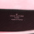 Louis Vuitton Twist MM Épi leather shoulder bag in black with rose-pink glazed edges, hot-pink LV Twist-lock, and silver chain strap