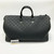 Louis Vuitton Keepall Bandoulière 50 in Absolute Black Monogram Taurillon leather with orange chain strap accents
