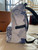 Louis Vuitton Discovery Backpack PM in Monogram Watercolor blue-and-white canvas with leather trim and silver-tone hardware