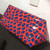 Louis Vuitton Alma BB in red Vernis patent leather with raised jungle dot accents and silver-tone hardware
