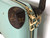 Louis Vuitton Vernis Mott shoulder bag in vibrant green with brass hardware.