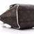 Interior view of Louis Vuitton Ellipse BB showing cocoa-brown fabric lining and zip pocket