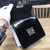 Gold S-lock closure detail on LV Spring Street bag