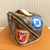 Side profile showcasing vintage travel sticker motif on LV Pouch-type Handbag