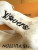Louis Vuitton Bone Key Holder Bag Charm M02285 in white leather with embossed Monogram and gold-tone snap hook, new with tags.