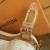 Louis Vuitton Bone Key Holder Bag Charm M02285 in white leather with embossed Monogram and gold-tone snap hook, new with tags.