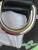 Louis Vuitton LV × TM Nano Speedy bag in black Monogram Multicolor canvas with rainbow Takashi Murakami motifs and gold hardware.