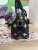 Louis Vuitton LV × TM Nano Speedy bag in black Monogram Multicolor canvas with rainbow Takashi Murakami motifs and gold hardware.