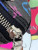 Louis Vuitton LV × TM Nano Speedy bag in black Monogram Multicolor canvas with rainbow Takashi Murakami motifs and gold hardware.