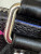 Louis Vuitton LV × TM Nano Speedy bag in black Monogram Multicolor canvas with rainbow Takashi Murakami motifs and gold hardware.