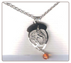 Squirrel in acorn with amber bead necklace.
Necklace is available in 14k goldfill