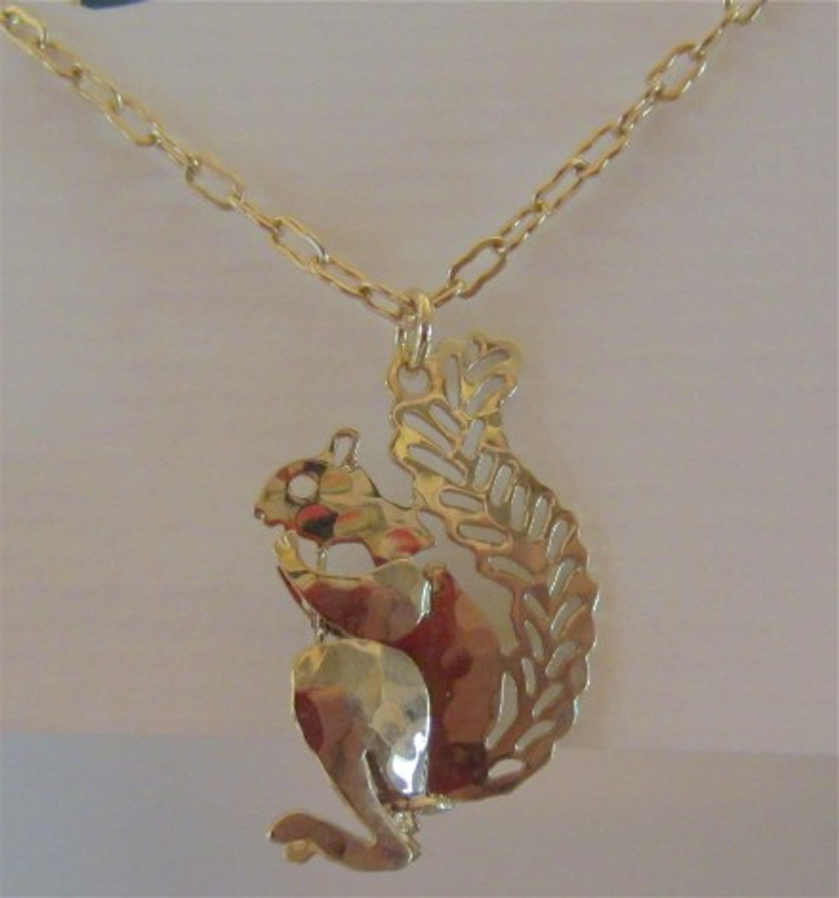 This 3-D squirrel necklace is very cute.