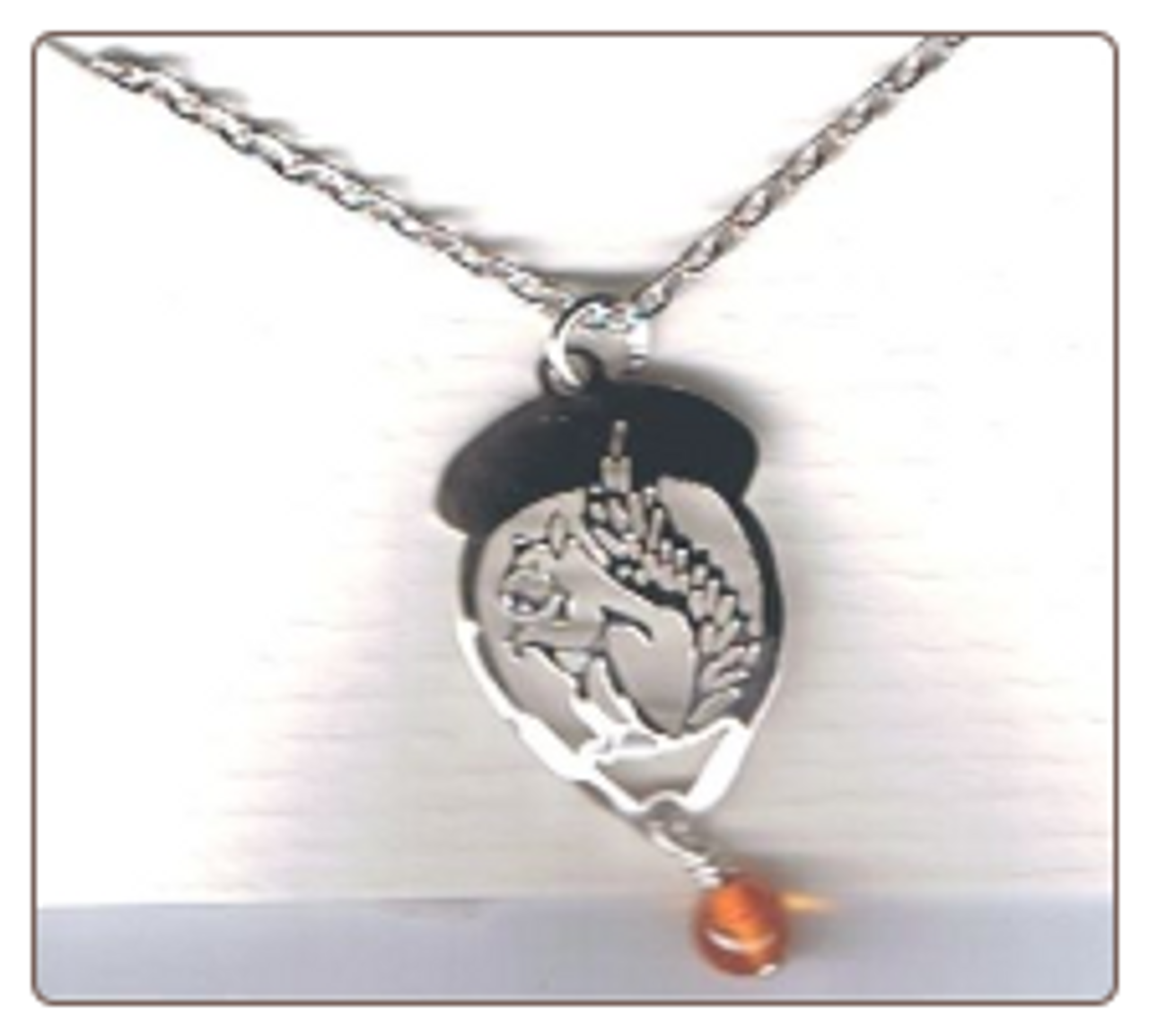 Squirrel in acorn with amber bead necklace.
Necklace is available in 14k goldfill