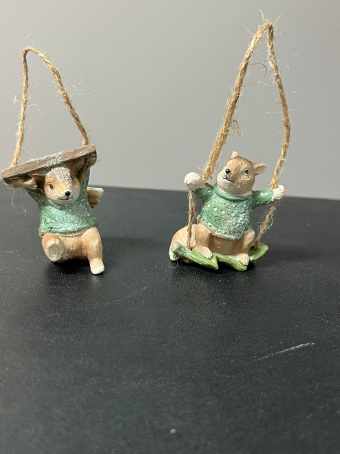 Cute squirrel on swing or holding swing ornament.