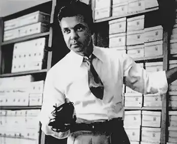 An image of Chet's Shoes founder with a dress shoe in hand