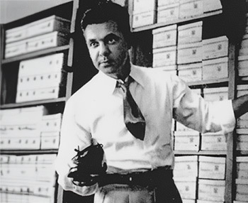 An image of Chet's Shoes founder with a dress shoe in hand