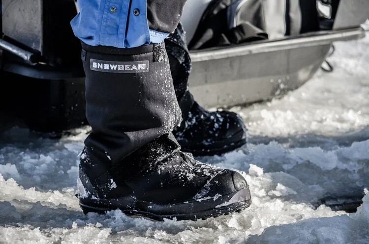 A Snowgear overshoe worn over a work boot on snow and ice