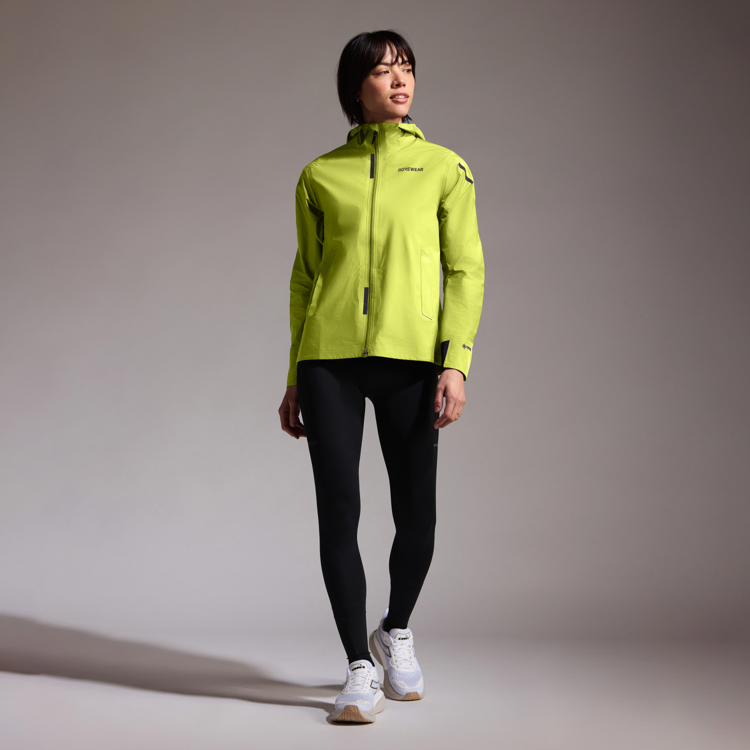 A product model is wearing the CONCURVE GORE-TEX Jacket Womens in size Small and is 175 cm / 5'9'' and weighs 66 kg / 145 lbs.