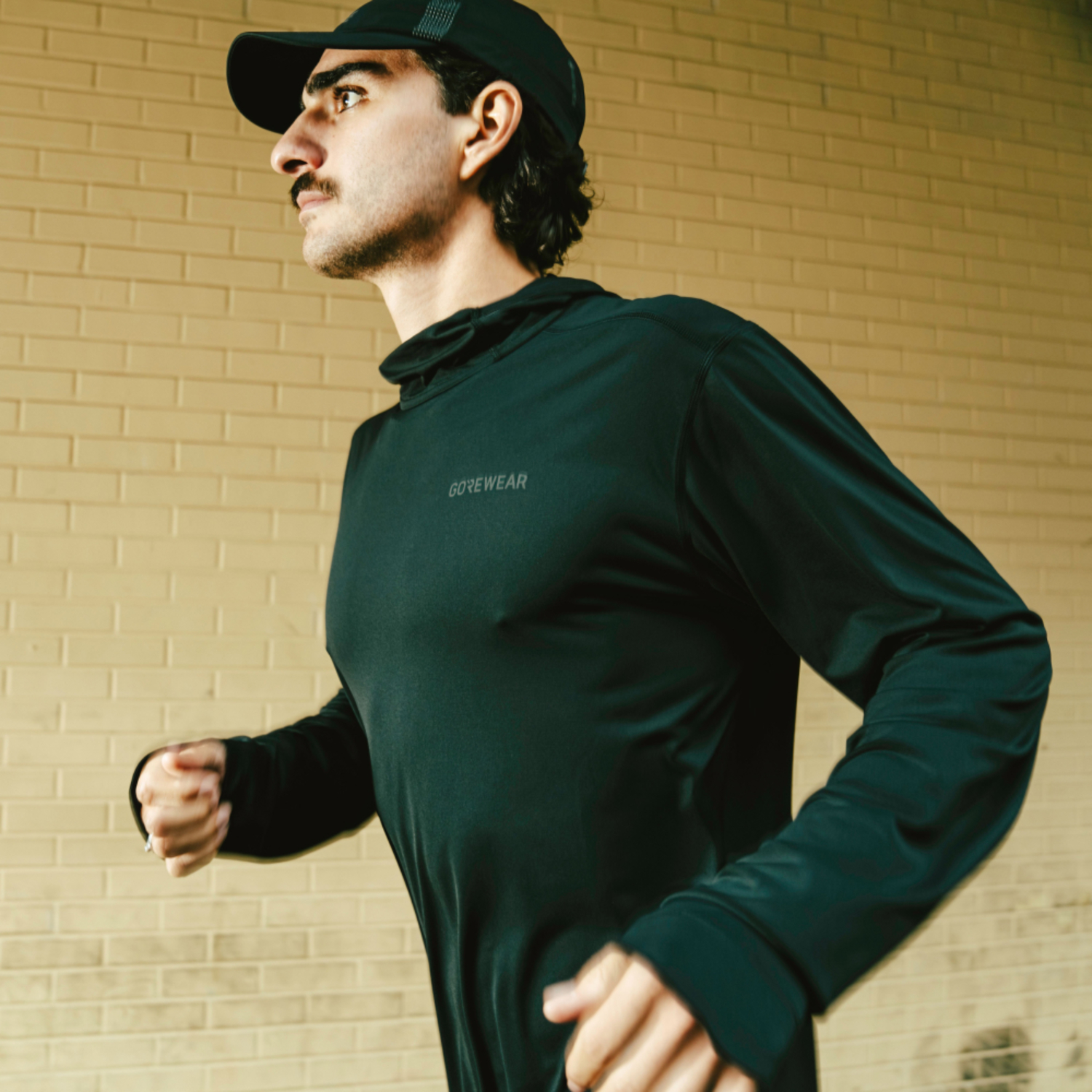 A lifestyle image of the Everyday Tech Hoodie Mens being used.