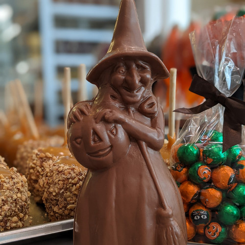 Milk Chocolate Witch holding jack-o-lantern
