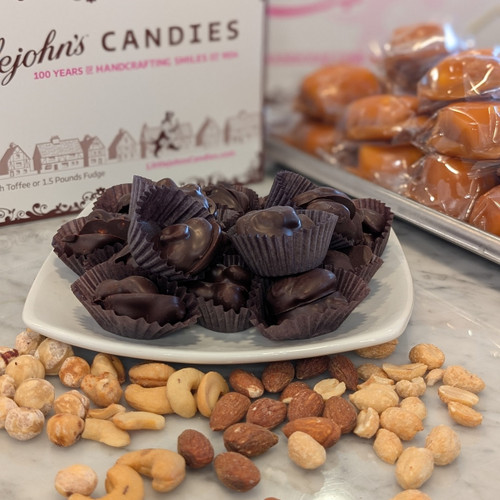 dish of dark chocolate covered nut clusters