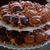 Tiered display tray with milk chocolate and dark chocolate topped pecan and caramel clusters