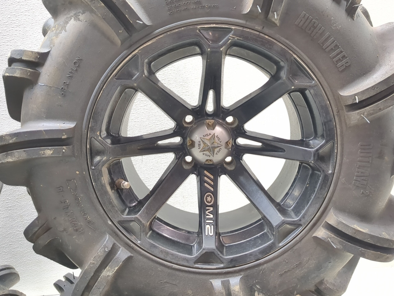 Set Of 4 MSA M12 Rim Wheels 14X7 W/ High Lifter OUTLAW 2 28X9.5-14